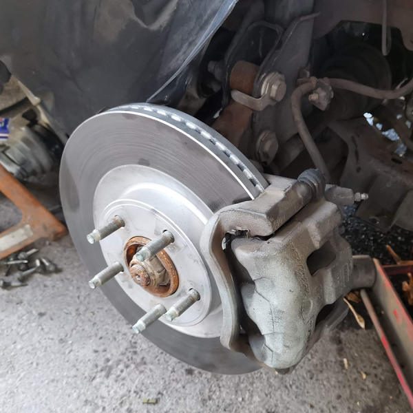 disc brake on a right front wheel. tire is removed.